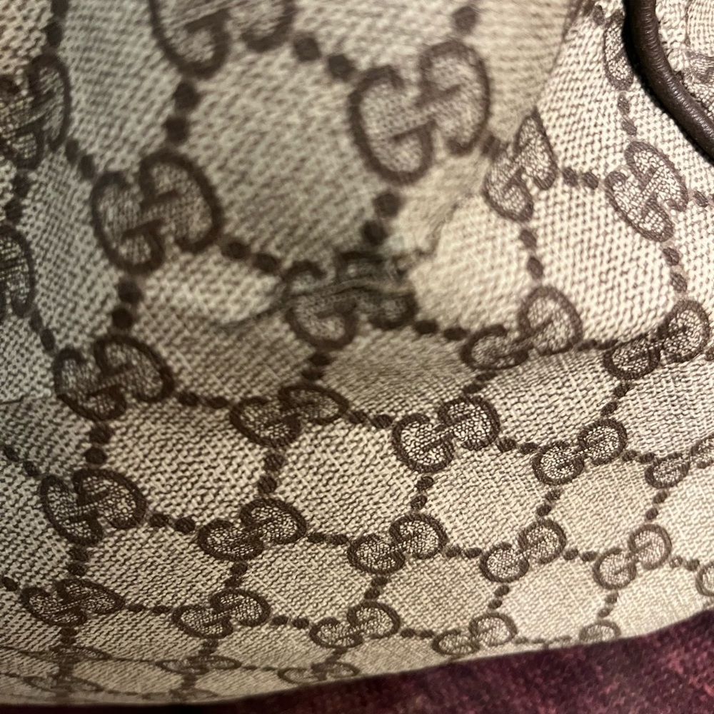 Vintage Gucci carry bag with straps. Small cuts.